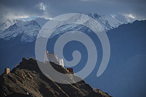 Namgyal Tsemo Gompa from behind and snow mountain range background Leh, Ladakh, India.