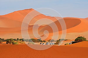 Namib-Naukluft national park, desert landscape, the highest world dunas. Parking cars at famous road trip spot