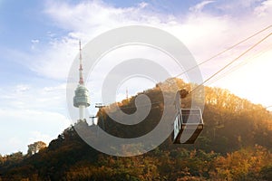 Namsan N Seoul Tower with the line of cable car at the sunset ti