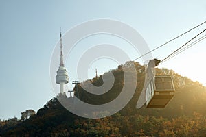 Namsan N Seoul Tower with the line of cable car at the sunset ti