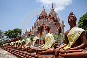 Massive buddha alignment at the Khao Aong Khar temple around Nang Rong, Buriram, Thailand. photo