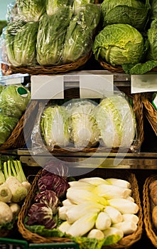 Napa cabbage on counter at market