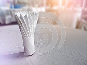 Napkin orderly manner fold in glass setting on dining table