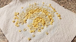 Napkin or paper towel with small pepper seeds