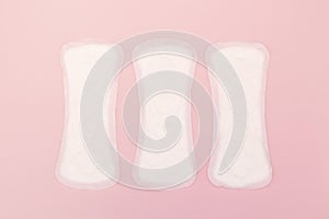 Sanitary napkin or sanitary pad for intimate hygiene on a pink background