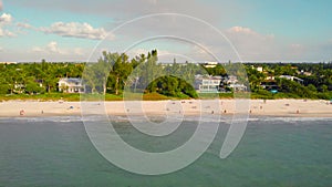 Naples beach and fishing pier at sunset, Florida.