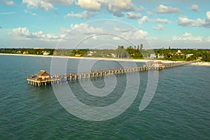 Naples Beach and Fishing Pier at Sunset, Florida.