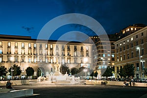 Naples, Italy. Fountain Of Neptune On Piazza Municipio In Evening Or Night Illuminations photo