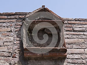 NAPLES, ITALY- JUNE, 13, 2019: low angle shot of a window of ruined building at pompeii