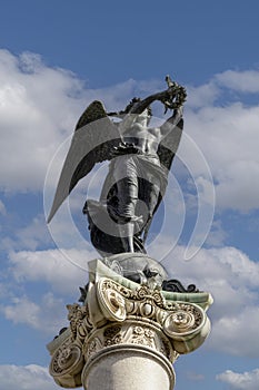 Statue of the Martyrs\' Virtue at the top of column of the Monument to the Martyrs, Naples, Italy photo