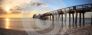 Naples Pier on the beach at sunset