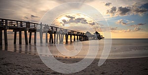 Naples Pier on the beach at sunset