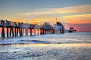 Naples Pier on the beach at sunset