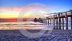 Naples Pier on the beach at sunset