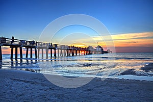 Naples Pier on the beach at sunset