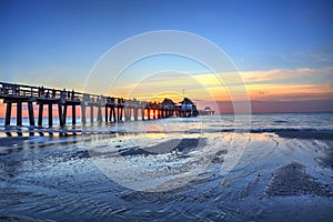 Naples Pier on the beach at sunset