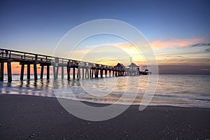 Naples Pier on the beach at sunset