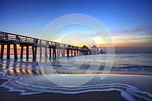 Naples Pier on the beach at sunset