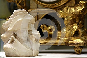 Napoleon Bonaparte bust, gold antique clock background