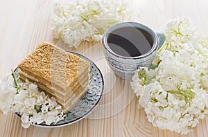 Napoleon cake, cup of coffee