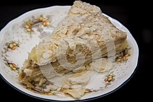Napoleon cake on a fine ceramic plate