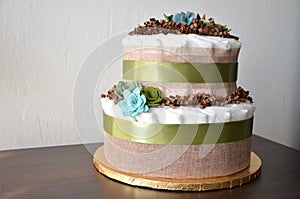 Nappy cake made from nappies, ribbons and flower seemed decorations