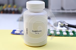 Naproxen pill in white bottle, pill stock