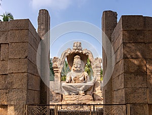 Narasimha statue from distance at Lakshmi Narasimha temple, Hampi, Karnataka, India