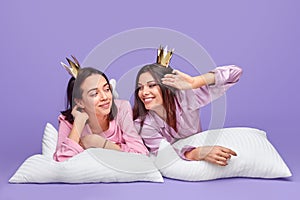 Narcissistic fellows in nightwear resting on pillows