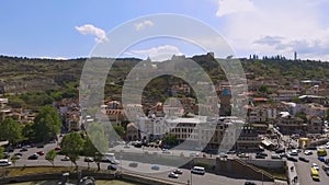 Narikala Fortress on hill, residential buildings at base of mountain, Tbilisi