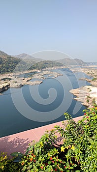 Narmada river with mountain range in background