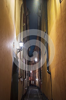 A narow alley in Gamla Stan, Stockholm, Sweden`s old town, with colorful 17th and 18th-century buildings and cobblestone streets