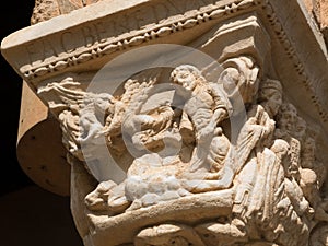 Narrative religious scene on a capital of the cloister of Monreale photo