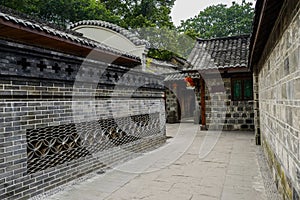 Narrow alley between aged Chinese dwelling houses
