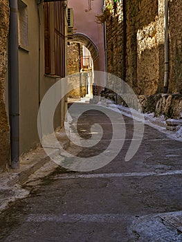 Narrow alley with decorated tunnel, in Pyrgi  medieval village, Chios island, Greece