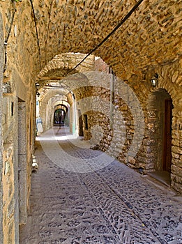 Narrow alley at the medieval castle village of Mesta in Chios island , Greece