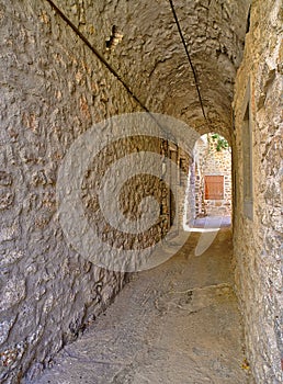 Narrow alley at the medieval castle village of Mesta in Chios island , Greece