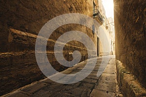 Narrow alley in the medieval historic city of Mdina, Malta