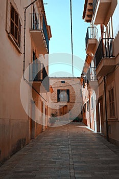 Narrow alley and Mediterranean architecture on the island of Mallorca, Spain.