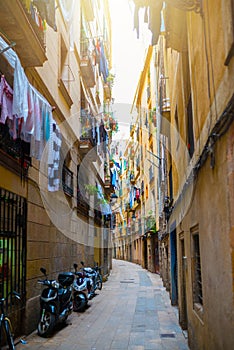 Narrow alley in old town Ciutat Vella of Barcelona photo