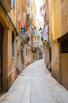 Narrow alley in old town Ciutat Vella of Barcelona photo