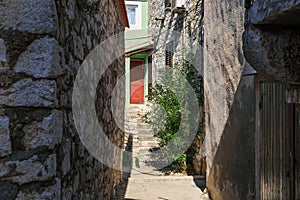 Narrow alley in old Tribunj, Croatia