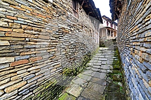 Narrow alley between stone houses