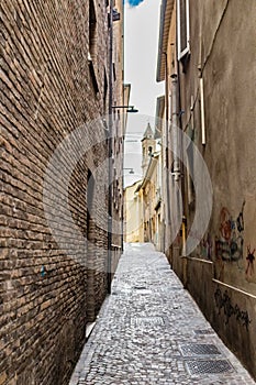 Narrow alleys between vertiginous walls of ancient buildings