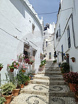 Narrow ally in small Andalusian town Frigiliana in Spain photo
