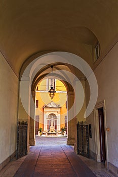 Narrow arched alley at the historic center Rome Italy