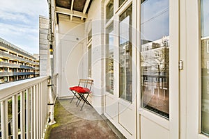 Narrow balcony with chair and door