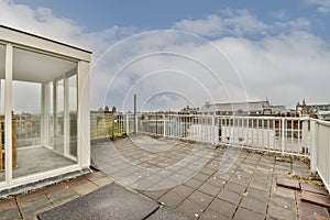 Narrow balcony with chair and door