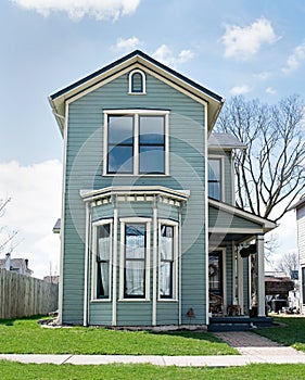 Narrow Blue House with Bay Window