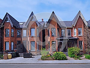 Narrow brick Victorian style houses with gables photo